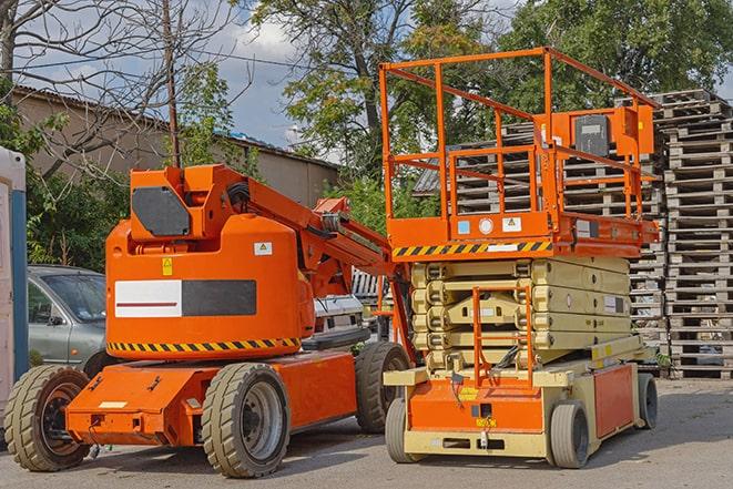 industrial forklift transporting goods in a warehouse setting in Laguna Hills, CA